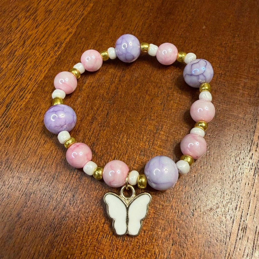 Pink, lavender, and white bracelet with Butterfly Charm